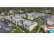 Aerial view of an apartment complex with a pool and ample parking at 7701 Starkey Rd # 324, Seminole, FL 33777