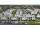 Aerial view of an apartment complex with a pool and ample parking at 7701 Starkey Rd # 324, Seminole, FL 33777