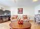 Living room features wood floors, a coffee table, and two armchairs at 7701 Starkey Rd # 324, Seminole, FL 33777