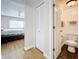 Small bathroom with toilet and shower, featuring dark tile floors at 7701 Starkey Rd # 324, Seminole, FL 33777