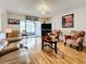 Spacious living room with hardwood floors and comfortable seating at 7701 Starkey Rd # 324, Seminole, FL 33777