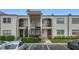 Two-story building with four units and well-maintained landscaping at 7701 Starkey Rd # 324, Seminole, FL 33777