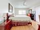 Spacious bedroom with king-size bed, wood floors, and ample closet space at 7701 Starkey Rd # 324, Seminole, FL 33777