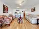 Spacious living area with hardwood floors and comfortable seating at 7701 Starkey Rd # 324, Seminole, FL 33777