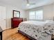 Bedroom with a queen-size bed, dresser, and wood floors at 7701 Starkey Rd # 324, Seminole, FL 33777