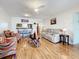 Open living room with hardwood floors and comfortable seating at 7701 Starkey Rd # 324, Seminole, FL 33777