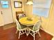 Charming dining area with a round table and four white chairs at 9790 66Th N St # 208, Pinellas Park, FL 33782