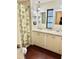 Clean bathroom with dual sinks and a large walk-in shower at 9790 66Th N St # 208, Pinellas Park, FL 33782