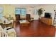 Living room with laminate floor and comfy seating at 9790 66Th N St # 208, Pinellas Park, FL 33782