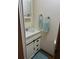 Clean bathroom with a single sink and plenty of storage at 9790 66Th N St # 208, Pinellas Park, FL 33782