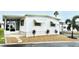 Mobile home with carport and landscaping at 9790 66Th N St # 208, Pinellas Park, FL 33782