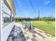 Relaxing backyard patio with seating area and grass at 754 Melody Ln, Bradenton, FL 34207