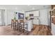 Modern kitchen with white cabinets, granite island, and stainless steel appliances at 10268 Kalamazoo Pl, Parrish, FL 34219