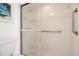 Bathroom with walk-in shower and grab bar at 11485 Oakhurst Rd # 322, Largo, FL 33774