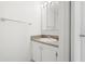 Simple bathroom with a sink, vanity, mirror and towel rack at 11485 Oakhurst Rd # 322, Largo, FL 33774