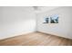 Bedroom with a window providing natural light and wood flooring at 11485 Oakhurst Rd # 322, Largo, FL 33774