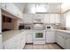 Updated white kitchen with ample counter space and modern appliances at 1200 N Shore Ne Dr # 216, St Petersburg, FL 33701