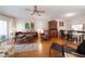 Open living space with hardwood floors, daybed, and dining area at 1200 N Shore Ne Dr # 216, St Petersburg, FL 33701