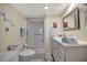 Clean bathroom with a walk-in shower, vanity, and updated fixtures at 122 E Saint Johns Way, Apollo Beach, FL 33572