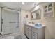 Clean bathroom with walk-in shower and gray vanity at 122 E Saint Johns Way, Apollo Beach, FL 33572