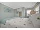Relaxing bedroom with a comfortable bed and beach-themed decor at 122 E Saint Johns Way, Apollo Beach, FL 33572
