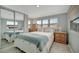 Main bedroom with mirrored closet doors and wood dresser at 122 E Saint Johns Way, Apollo Beach, FL 33572