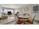 Casual dining area with a round table and four chairs, adjacent to the living room at 122 E Saint Johns Way, Apollo Beach, FL 33572