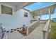 Covered porch with access ramp leading to home at 122 E Saint Johns Way, Apollo Beach, FL 33572