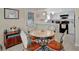 Cozy kitchen with white cabinets, black appliances, and a breakfast bar at 122 E Saint Johns Way, Apollo Beach, FL 33572