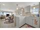 Modern kitchen with white cabinets and breakfast bar at 122 E Saint Johns Way, Apollo Beach, FL 33572