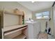 Functional laundry room with washer, dryer, and storage at 122 E Saint Johns Way, Apollo Beach, FL 33572
