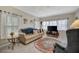 Bright living room featuring a comfy couch, large TV, and stylish rug at 122 E Saint Johns Way, Apollo Beach, FL 33572