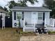 Quaint cottage with a deck and fenced yard at 3809 N Garrison St, Tampa, FL 33619