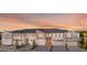 Modern townhouses with attached garages and sunset view at 4351 Cloud Hopper Way, Lutz, FL 33559