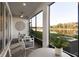 Relaxing screened porch overlooking a tranquil lake at 4351 Cloud Hopper Way, Lutz, FL 33559