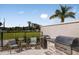 Outdoor grilling area with seating and a grassy view at 4351 Cloud Hopper Way, Lutz, FL 33559