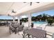 Covered patio area with tables near the community pool at 4351 Cloud Hopper Way, Lutz, FL 33559
