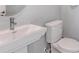 Clean bathroom with modern vanity and toilet at 4351 Cloud Hopper Way, Lutz, FL 33559