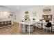 Spacious ' playroom with two work desks and a comfortable lounge area at 4357 Cloud Hopper Way, Lutz, FL 33559