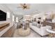 Spacious living room with a comfortable sofa and access to a lanai at 4357 Cloud Hopper Way, Lutz, FL 33559