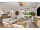 Living room with access to a relaxing lanai and comfortable seating at 4357 Cloud Hopper Way, Lutz, FL 33559