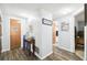 Long hallway with wood floors, leading to bedrooms and bathroom at 7511 Tyson Dr, Port Richey, FL 34668