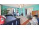 Large sunroom with multiple seating areas and sliding doors at 7511 Tyson Dr, Port Richey, FL 34668
