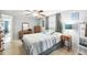 Cozy bedroom with a double bed, dresser, and lots of natural light at 7511 Tyson Dr, Port Richey, FL 34668