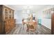 Inviting dining room with an oval table and chairs, plus a large wooden hutch at 7511 Tyson Dr, Port Richey, FL 34668