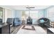 Relaxing Gathering room with comfy seating, a ceiling fan, and plenty of natural light at 7511 Tyson Dr, Port Richey, FL 34668