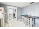 Convenient laundry room with washer, dryer, and extra storage at 7511 Tyson Dr, Port Richey, FL 34668