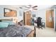 Bedroom with a double bed, desk, and plenty of space for storage at 7511 Tyson Dr, Port Richey, FL 34668