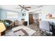 Bright and airy Gathering room with comfortable seating and a view into the dining area at 7511 Tyson Dr, Port Richey, FL 34668
