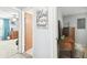 Hallway with doors to bedrooms and a vanity area at 7511 Tyson Dr, Port Richey, FL 34668
